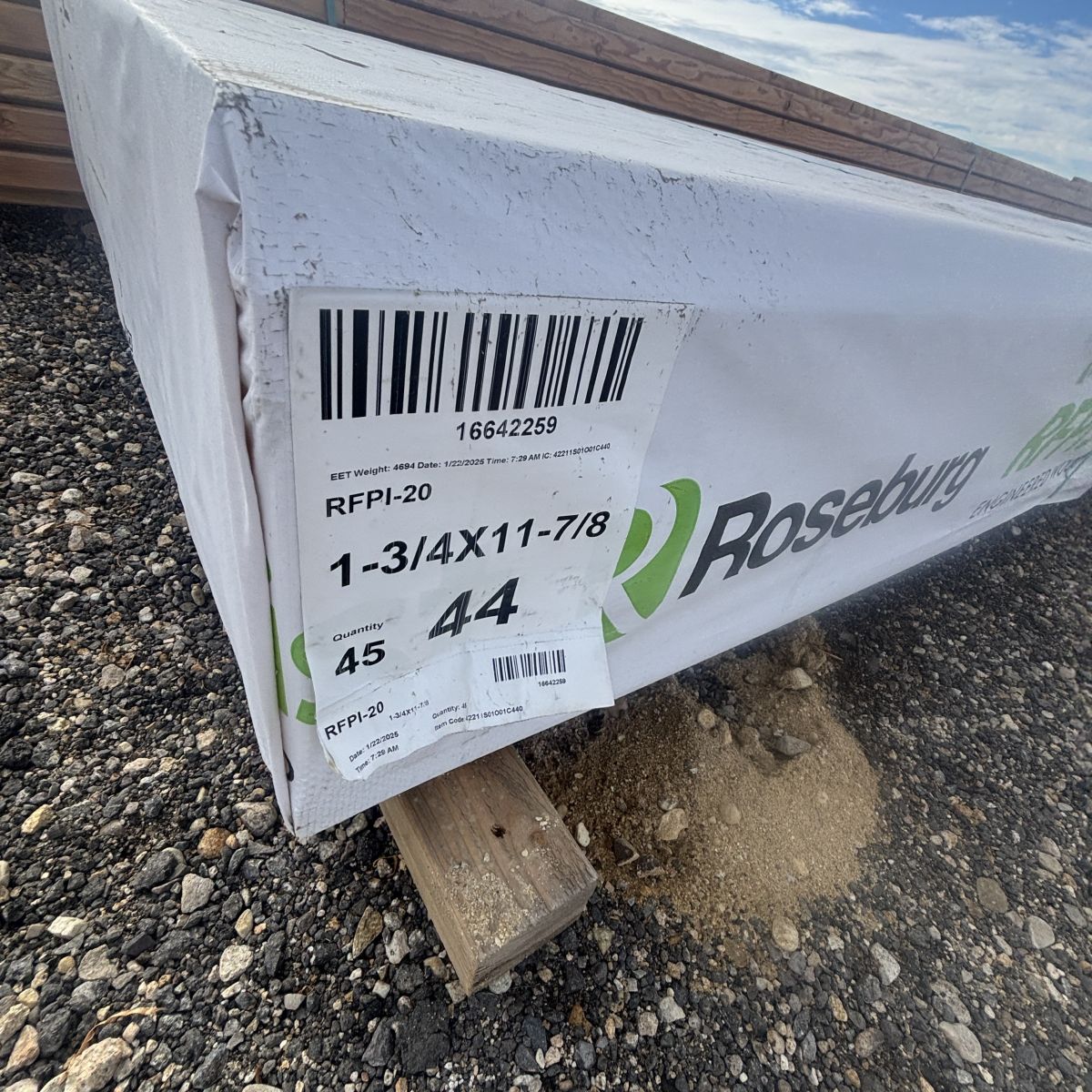 Polywrapped RFPI-20 11-7/8 inch engineered wood I-joist shown at angle with manufacturer label visible