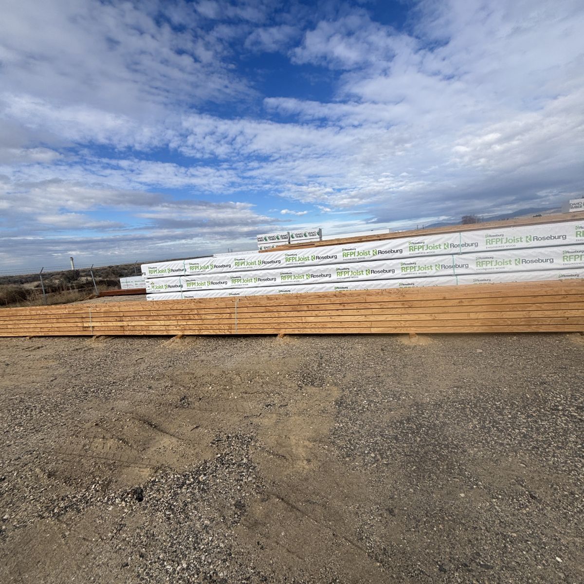 Full-length 60-foot RFPI-90 11-7/8 inch engineered wood I-joists stored at Boise lumberyard