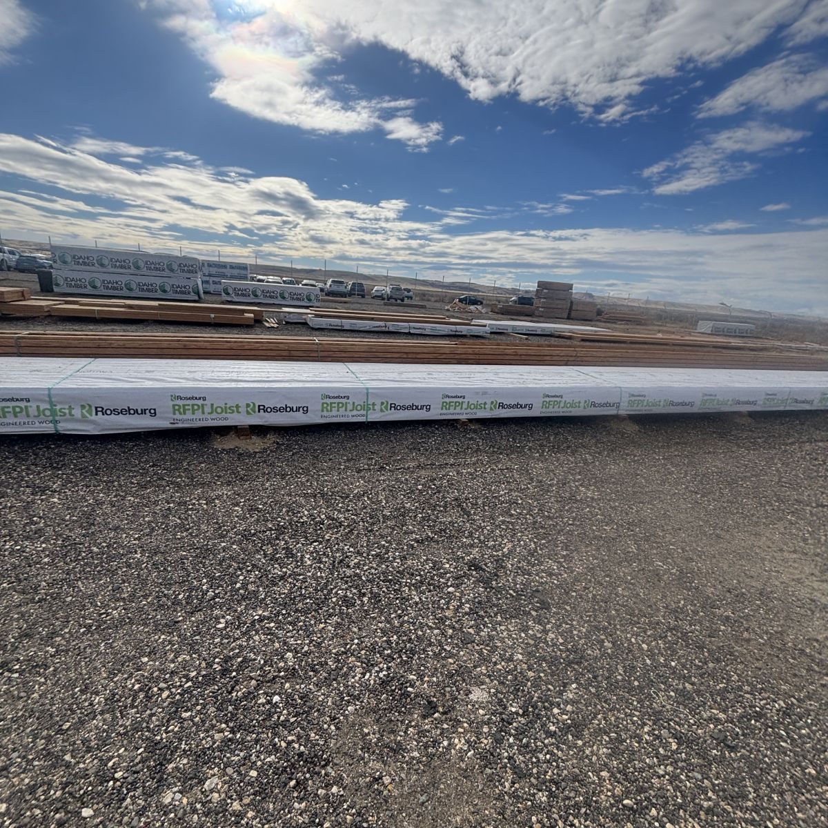 Wide view of full-length Roseburg RFPI-40 16 inch engineered wood I-joist stored at Boise lumberyard