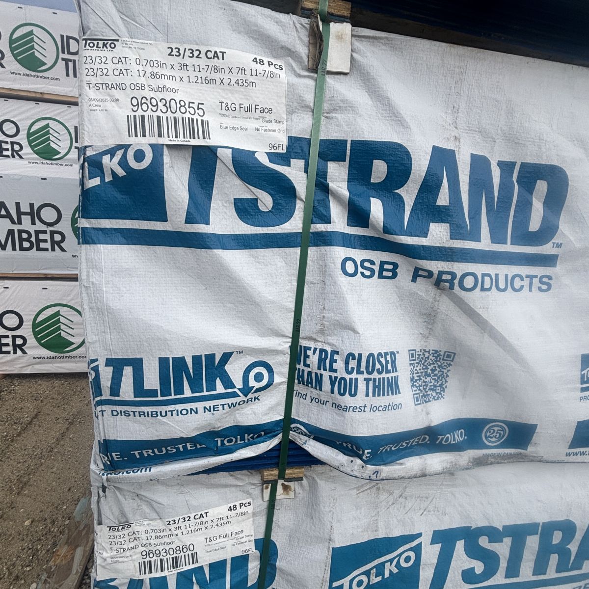 Wide-angle view of 23/32 inch tongue-and-groove 4x8 OSB subfloor sheathing stacked at Boise lumberyard