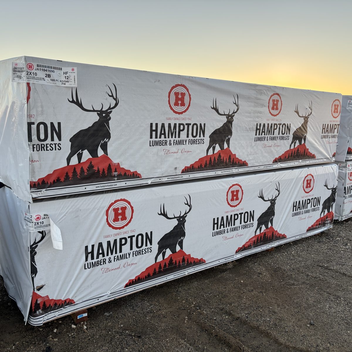 Angled view of wrapped 2x10x12 foot number 2 grade kiln-dried Hem-Fir lumber stored at Boise lumberyard