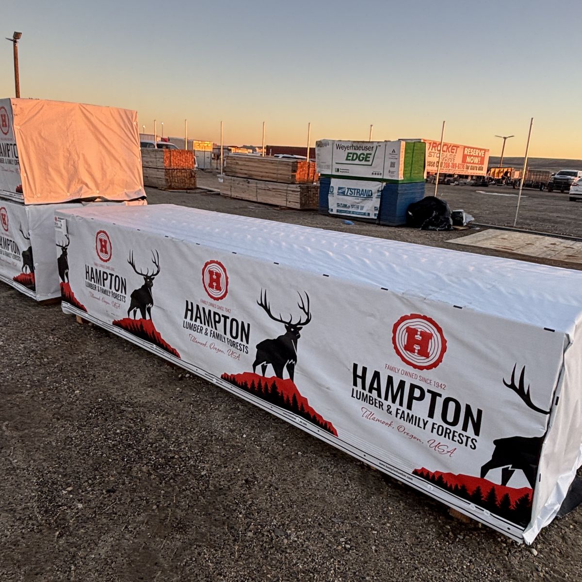 Angled yard view of stacked 2×12×12′ #2 kiln-dried Hem-Fir lumber at Boise lumberyard