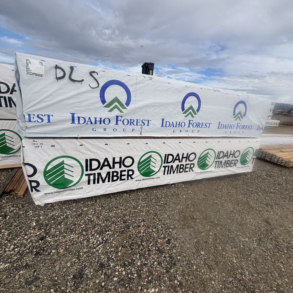 Multiple units of 2×12×14′ #2 kiln-dried Douglas Fir lumber stacked at Boise lumberyard