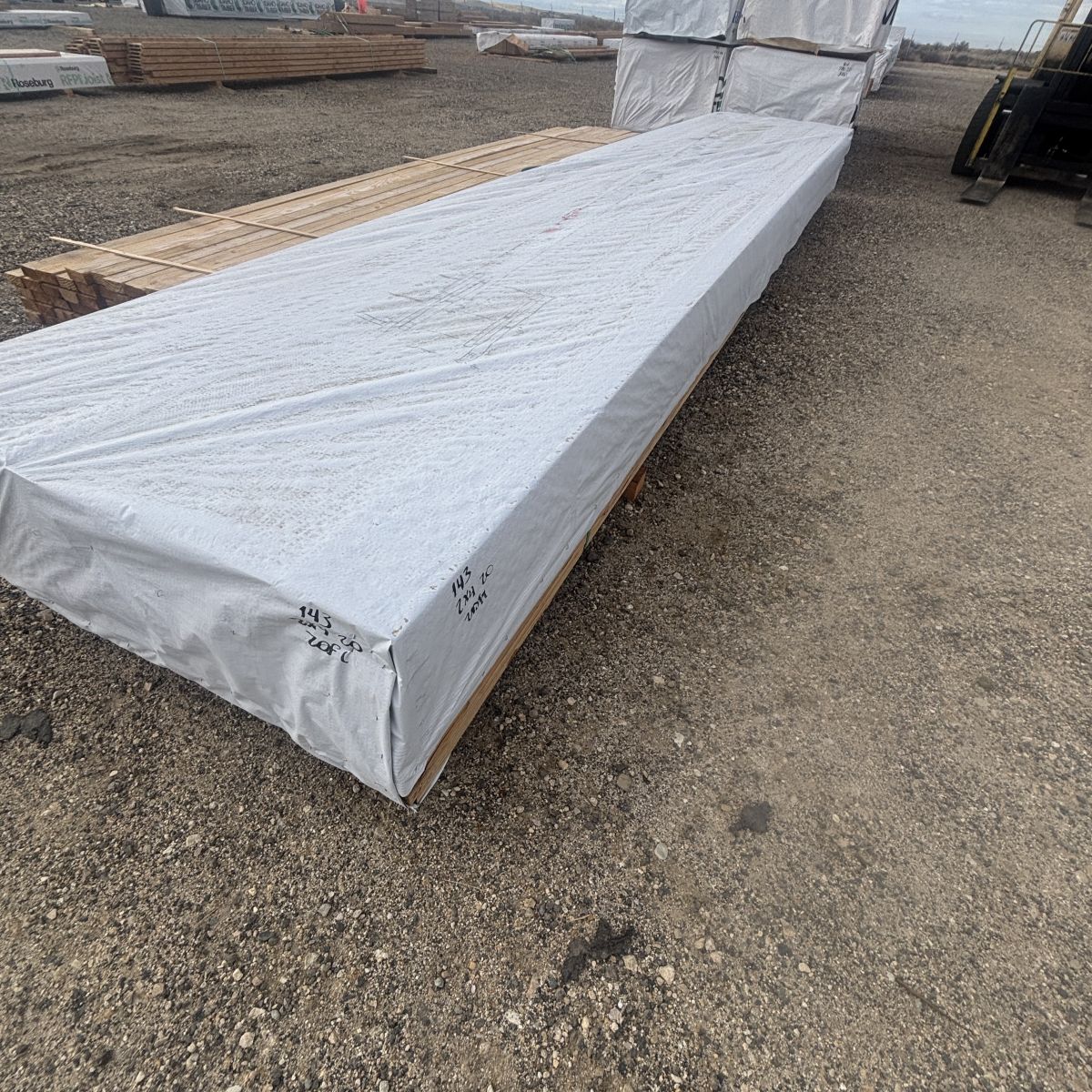 2x4-20-foot-number-2-grade-kiln-dried-douglas-fir-boise-lumberyard-forklift-behind.jpg