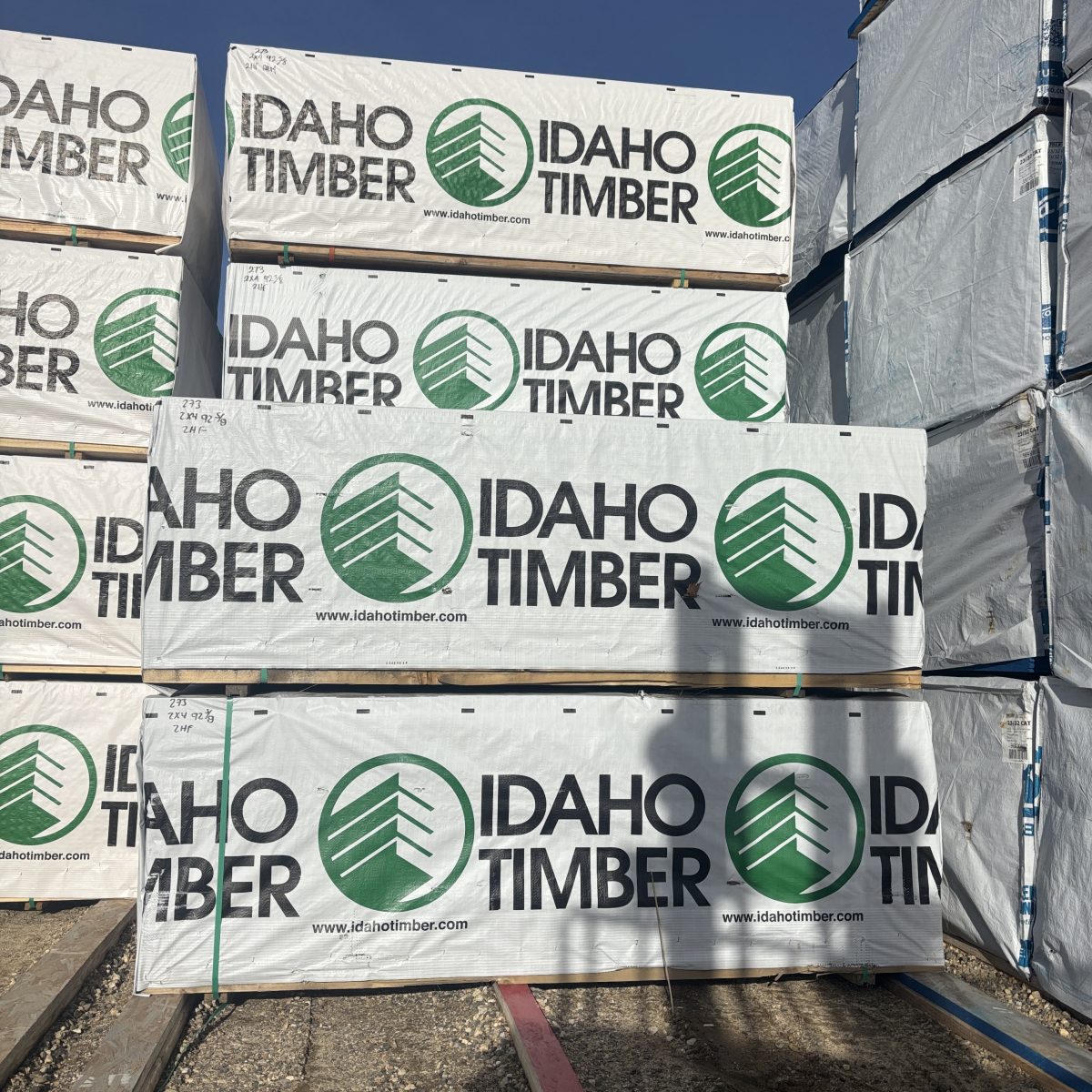 Wrapped units of 2×4 92-5/8″ #2 kiln-dried Hem-Fir precut studs staged at our Boise lumberyard