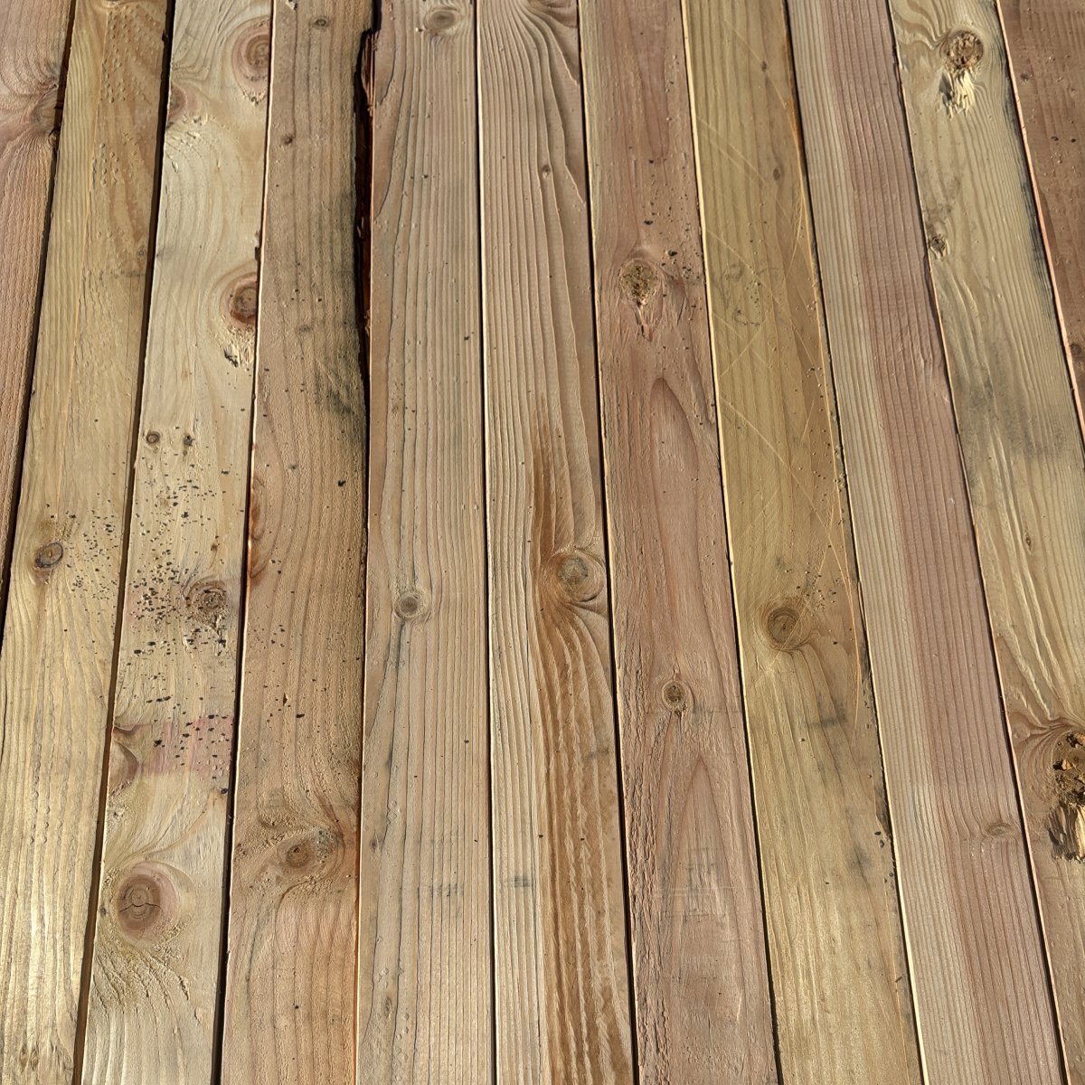 Top-down view of Douglas Fir wood texture on 2×4 #2 kiln-dried lumber showing grain pattern and surface detail