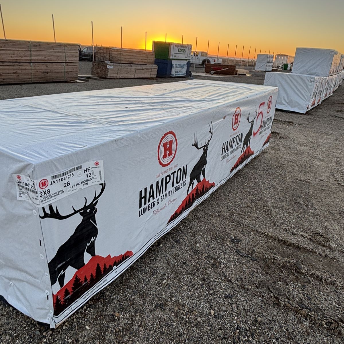 Angled view of stacked 2×8 12-foot #2 kiln-dried Hem-Fir lumber units at our Boise lumberyard