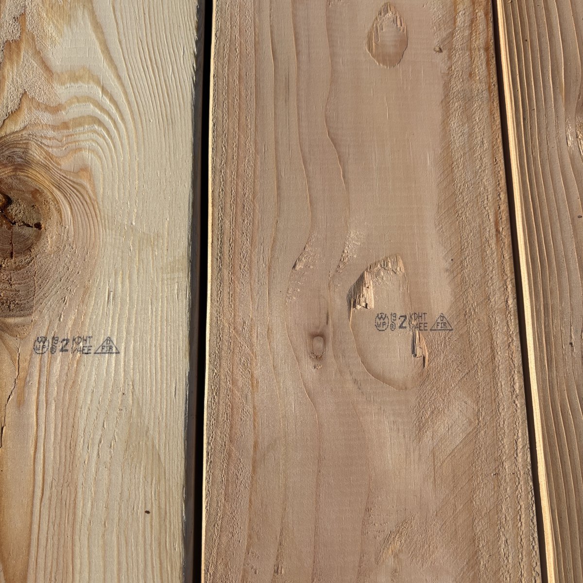 Grade stamp on 2×8 #2 kiln-dried Douglas Fir lumber showing grade and mill identification