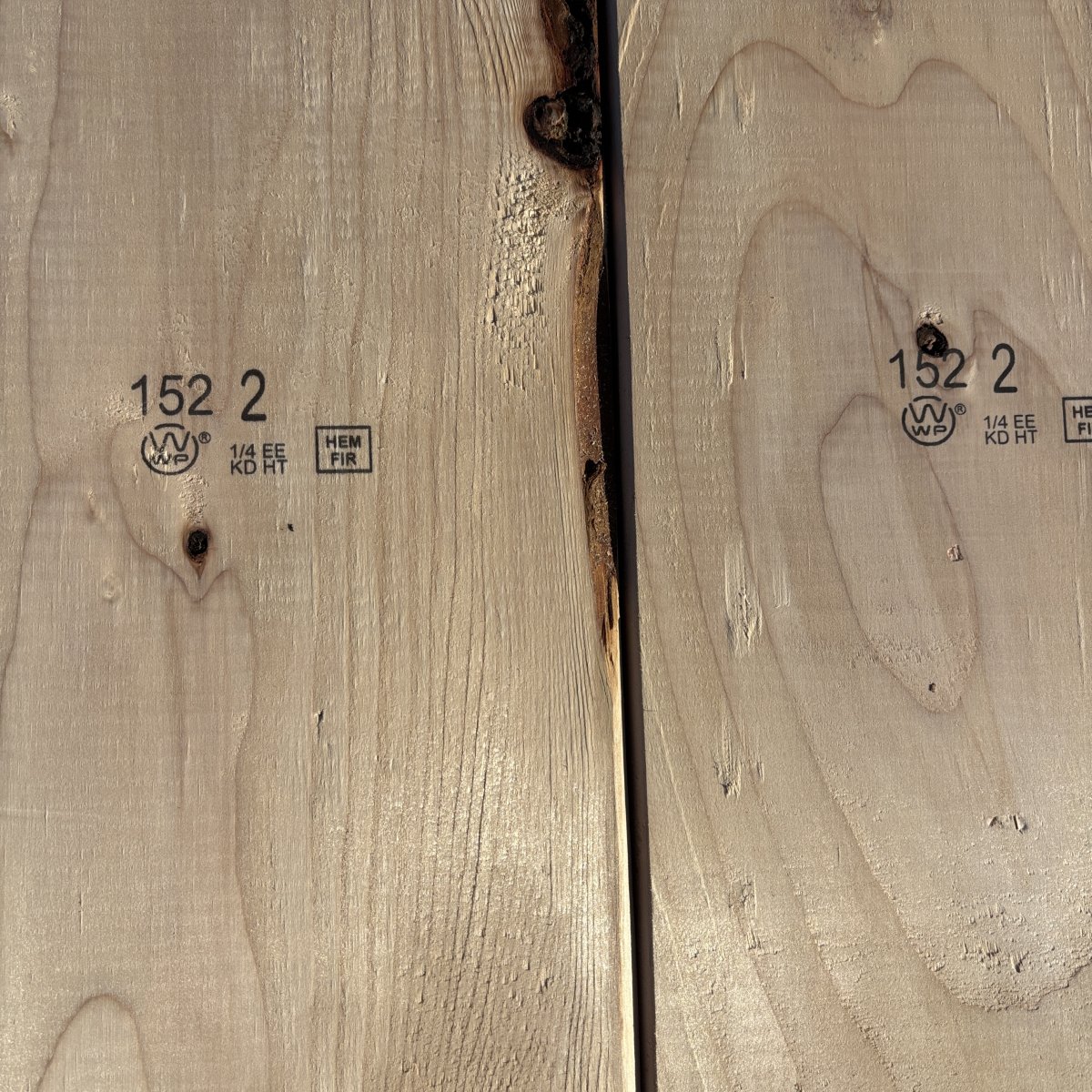 Mill grade stamp on 2×8 #2 kiln-dried Hem-Fir lumber showing grade and mill identification