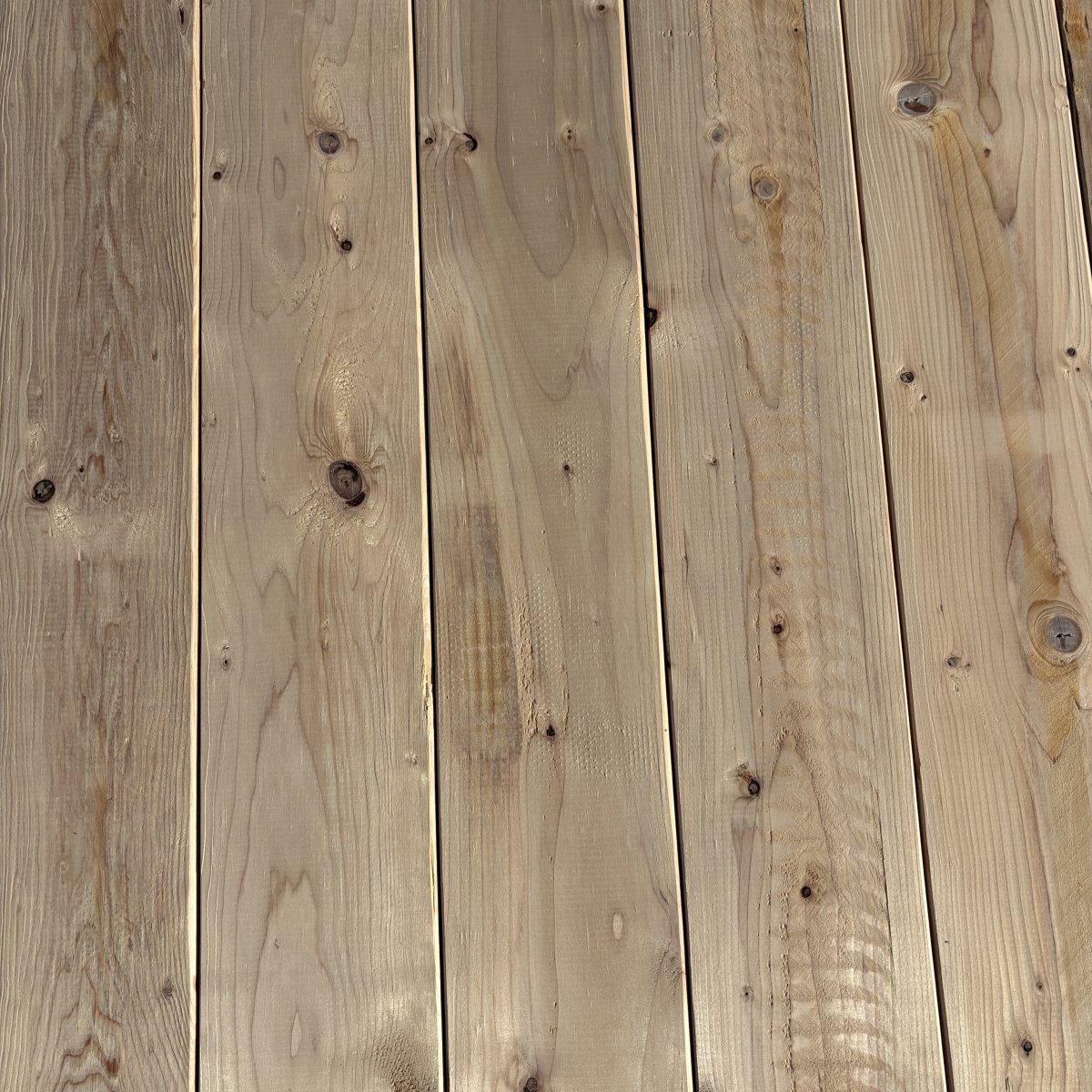 Top-down view of Hem-Fir wood texture on 2×8 #2 kiln-dried lumber showing grain pattern and surface detail
