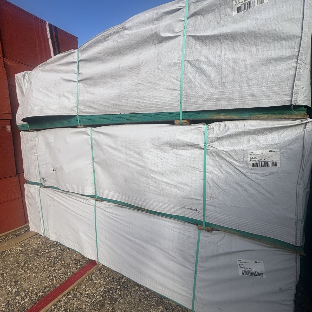 Angled view of 7/16-inch 4×10 OSB sheathing stored with neighboring lumber SKUs at our Boise lumberyard