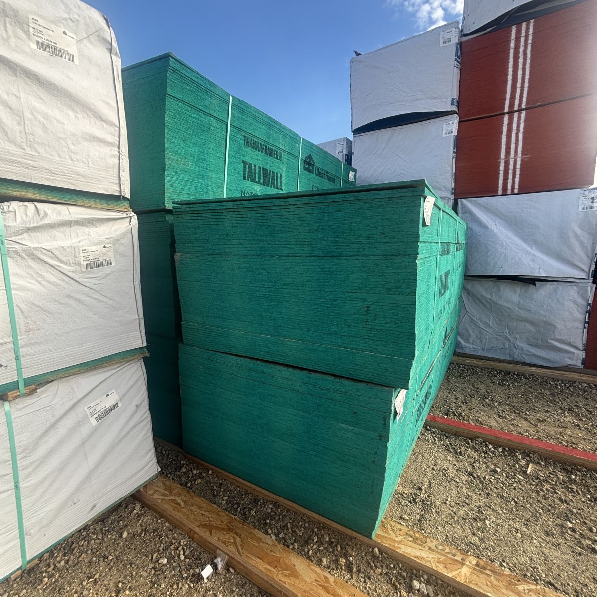 Side view of multiple stacks of 7/16-inch 4×9 OSB sheathing at our Boise lumberyard