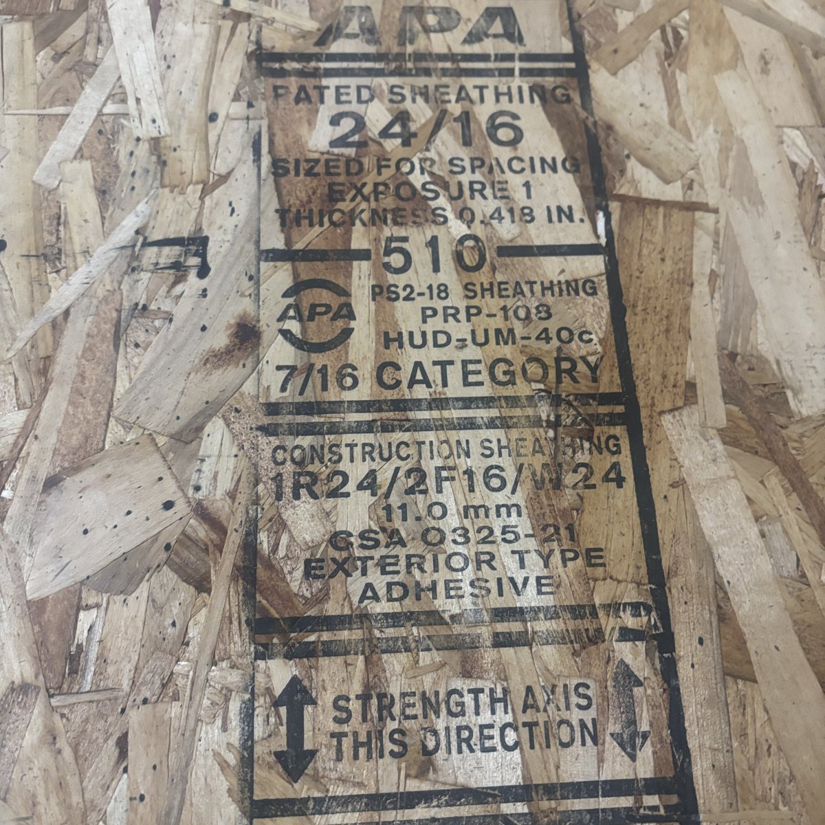Mill grade stamp on 7/16 inch OSB wall sheathing showing Exposure 1 rating and 24/16 span rating